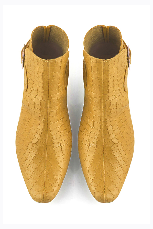 Mustard yellow women's ankle boots with buckles at the back. Round toe. Low block heels. Top view - Florence KOOIJMAN